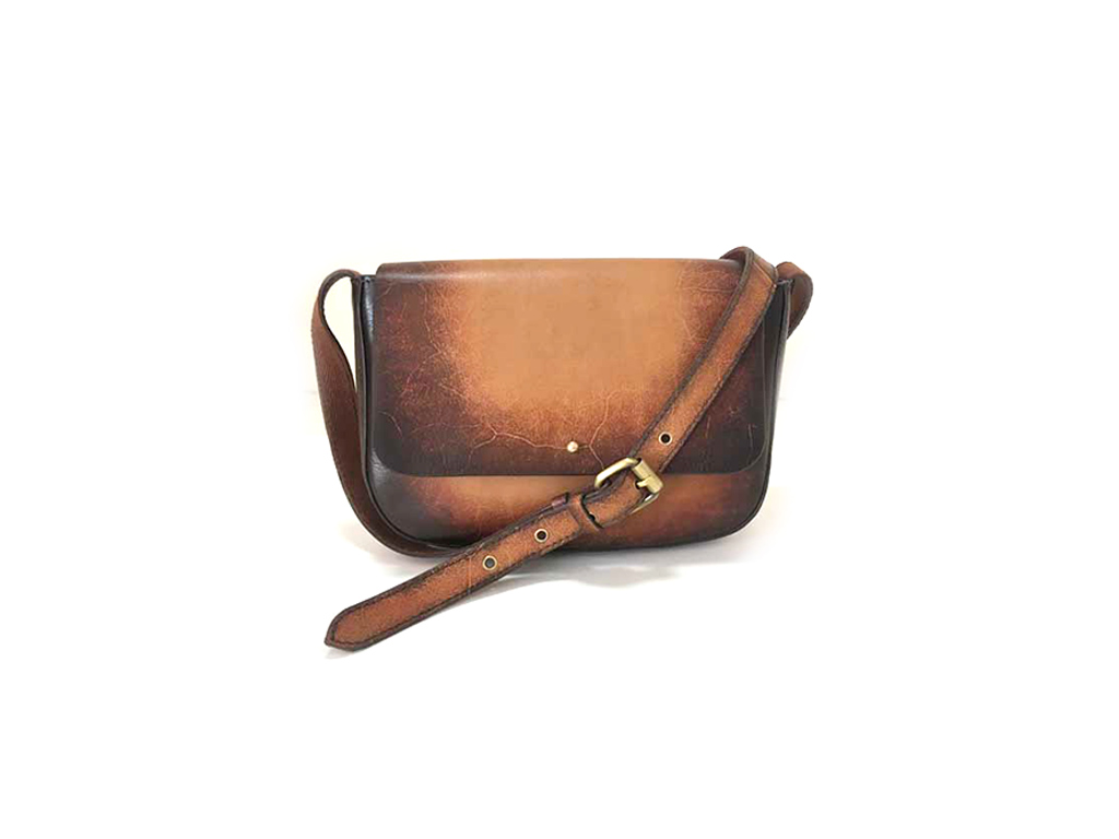Crossbody bag with a handle at the top and adjustable shoulder strap