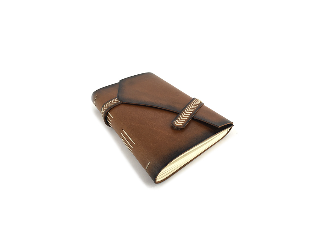 Leather journal with weaved strap closure,
size 6 X 8 inch with mill made paper